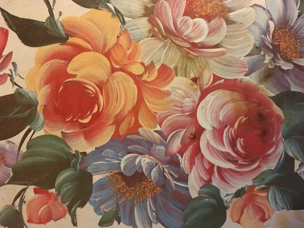 Close up photo of multi-colored flowers on a metal tray